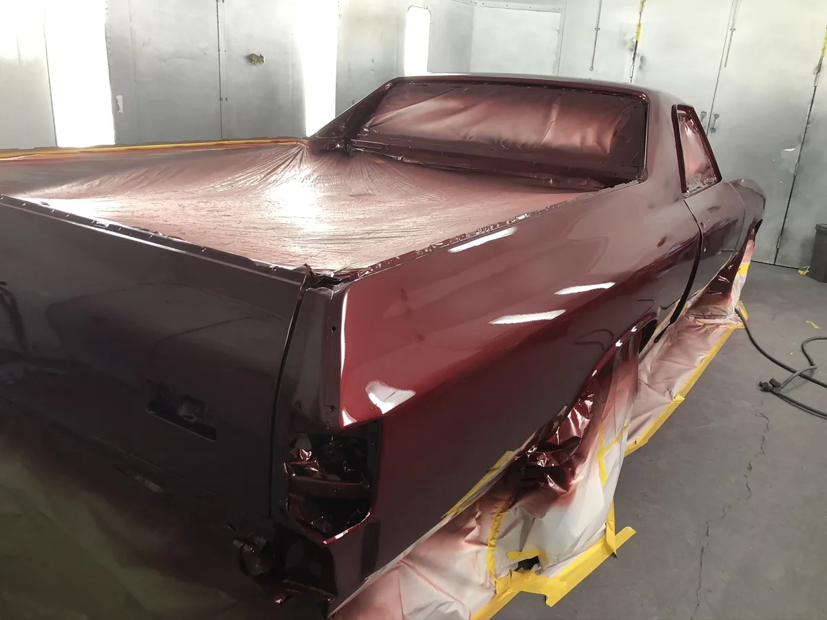 Burgundy pickup truck bed with fresh polished paint finish