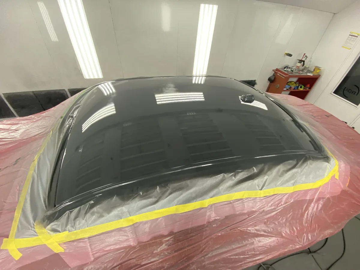 Panel with protective masking during paint curing process